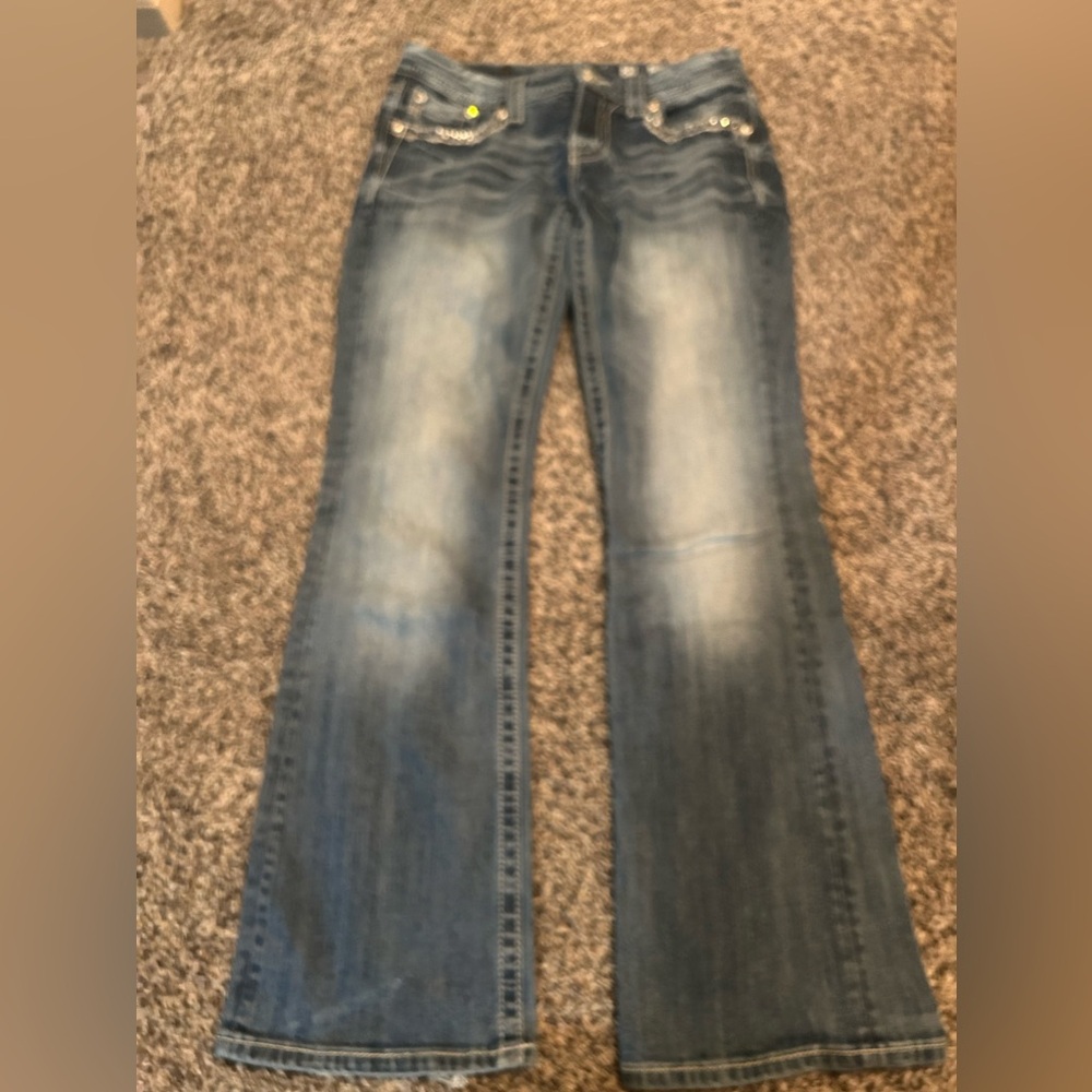 distress on the bottoms of the back pant legs from rubbing on shoes.